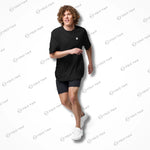 Model wearing black Cool-Fit Quick-Dry Athletic Tee Shirt while running, showcasing its relaxed fit and lightweight design.