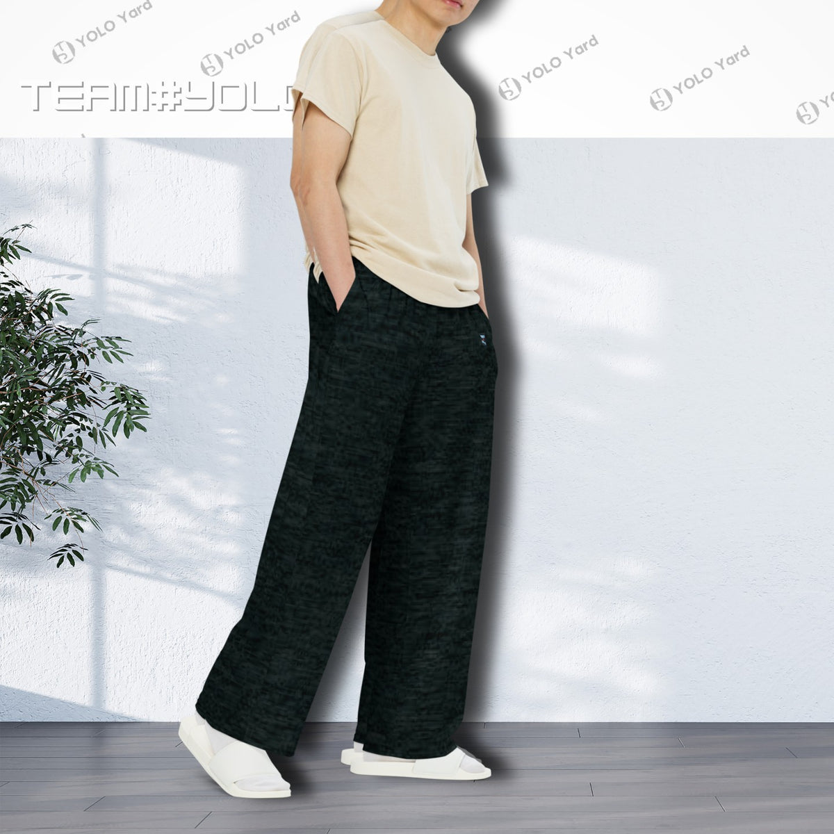 Dark Matter Wide-Leg Baggy Joggers styled by a man in a beige t-shirt, showing the side profile and casual fit.