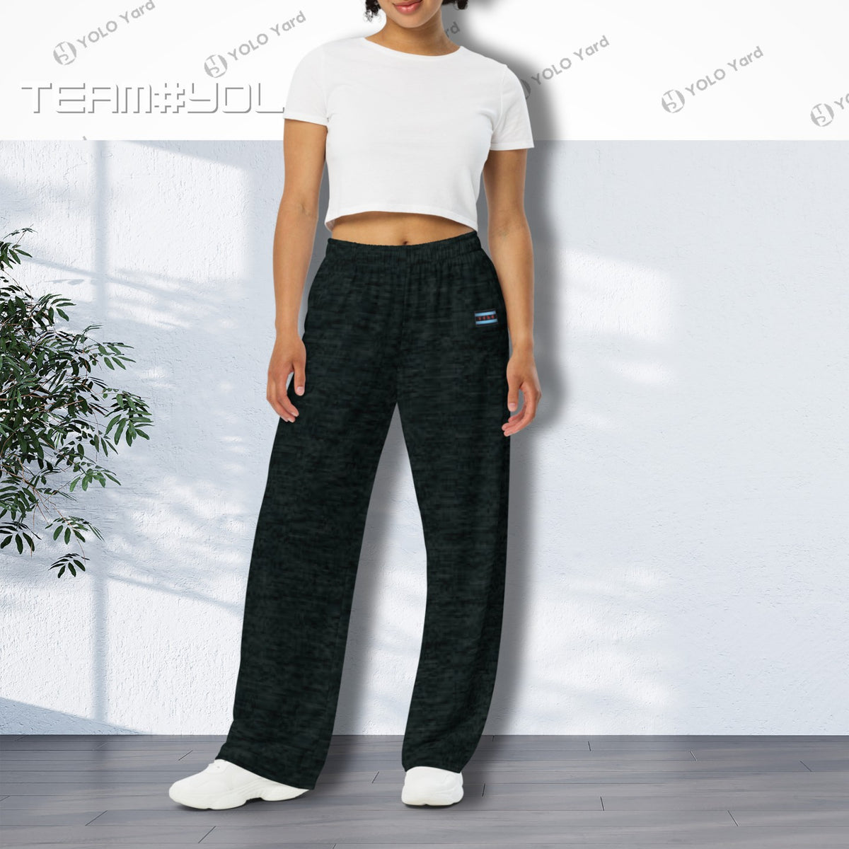 Dark Matter Wide-Leg Baggy Joggers worn by a woman in a white crop top, emphasizing the wide-leg silhouette and casual fit.