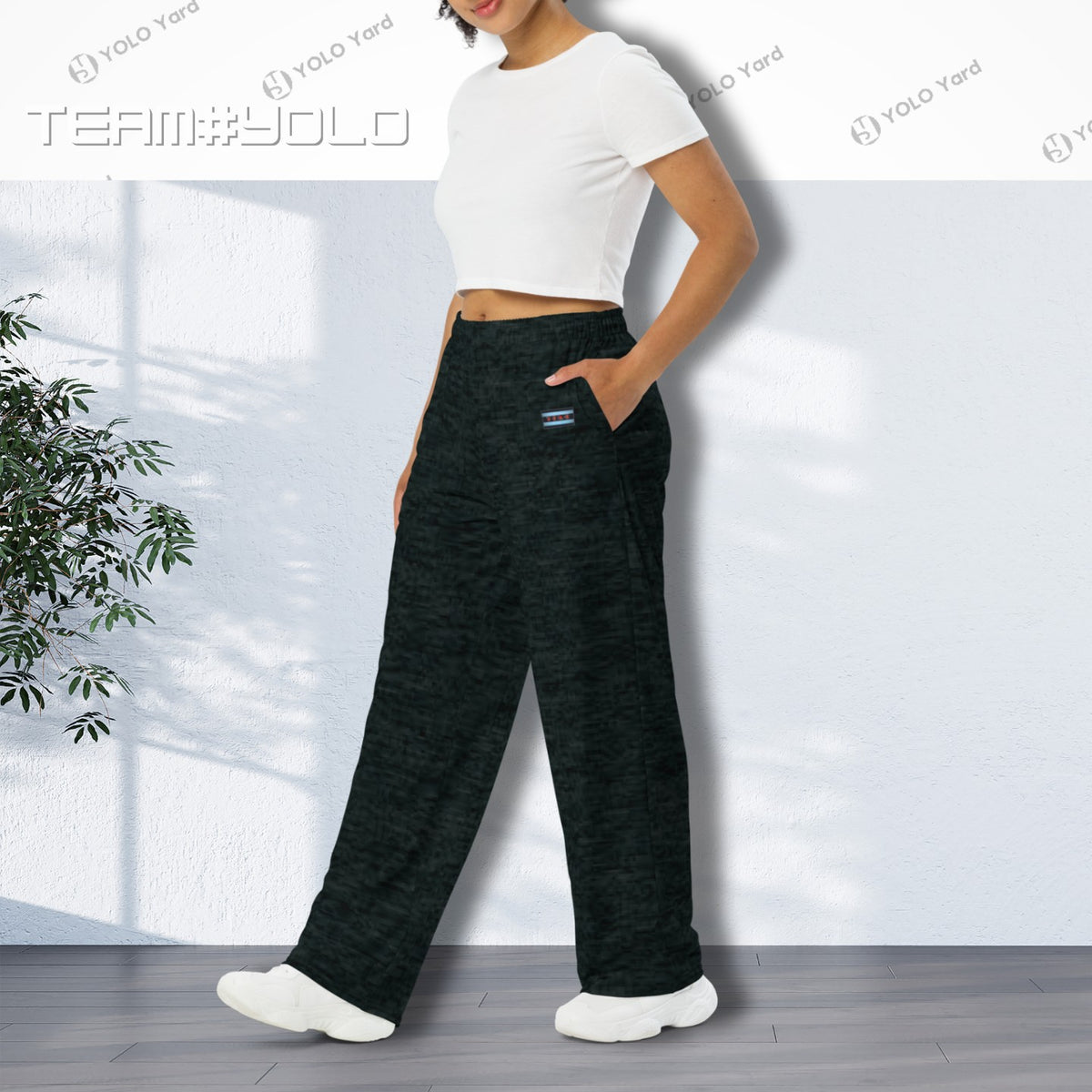 Dark Matter Wide-Leg Baggy Joggers worn by a woman in a white crop top, emphasizing the side pockets and relaxed fit.