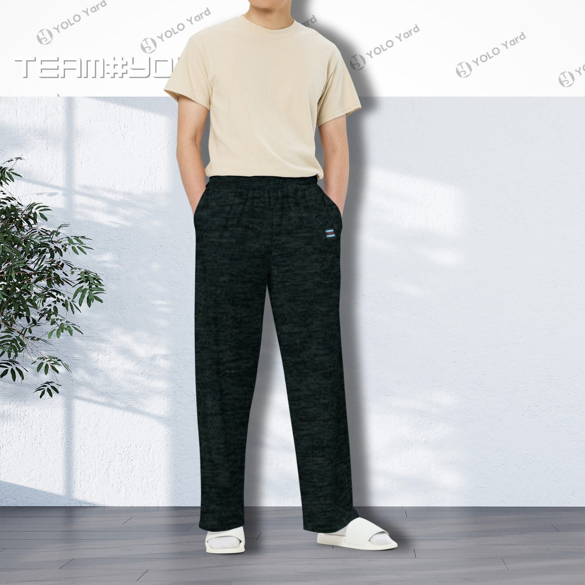 Dark Matter Wide-Leg Baggy Joggers styled by a man in a beige t-shirt, highlighting the comfortable and versatile design.