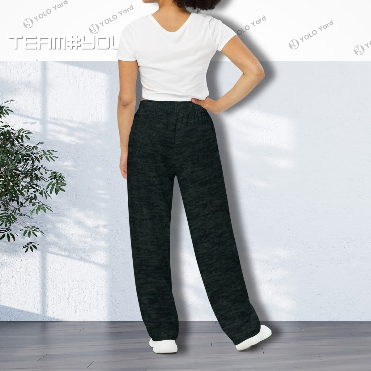 Back view of Dark Matter Wide-Leg Baggy Joggers worn by a woman, highlighting the high-waist design and wide-leg cut.