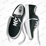 Edgewalker 2 black canvas sneakers with white laces displayed at an angle, highlighting their sleek and modern design.