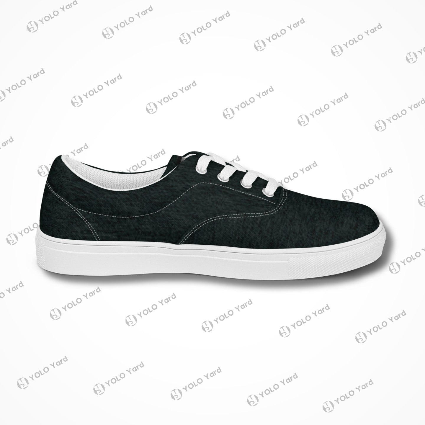 Side view of Edgewalker 2 black canvas sneakers with white soles, highlighting their sleek and minimalist design.