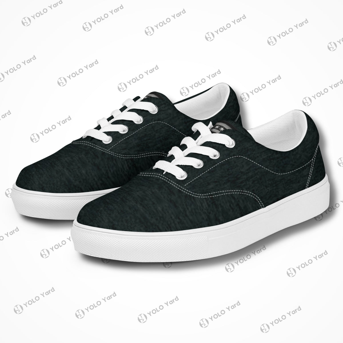 Pair of Edgewalker 2 black canvas sneakers with white soles and laces, offering a trendy and versatile footwear option.