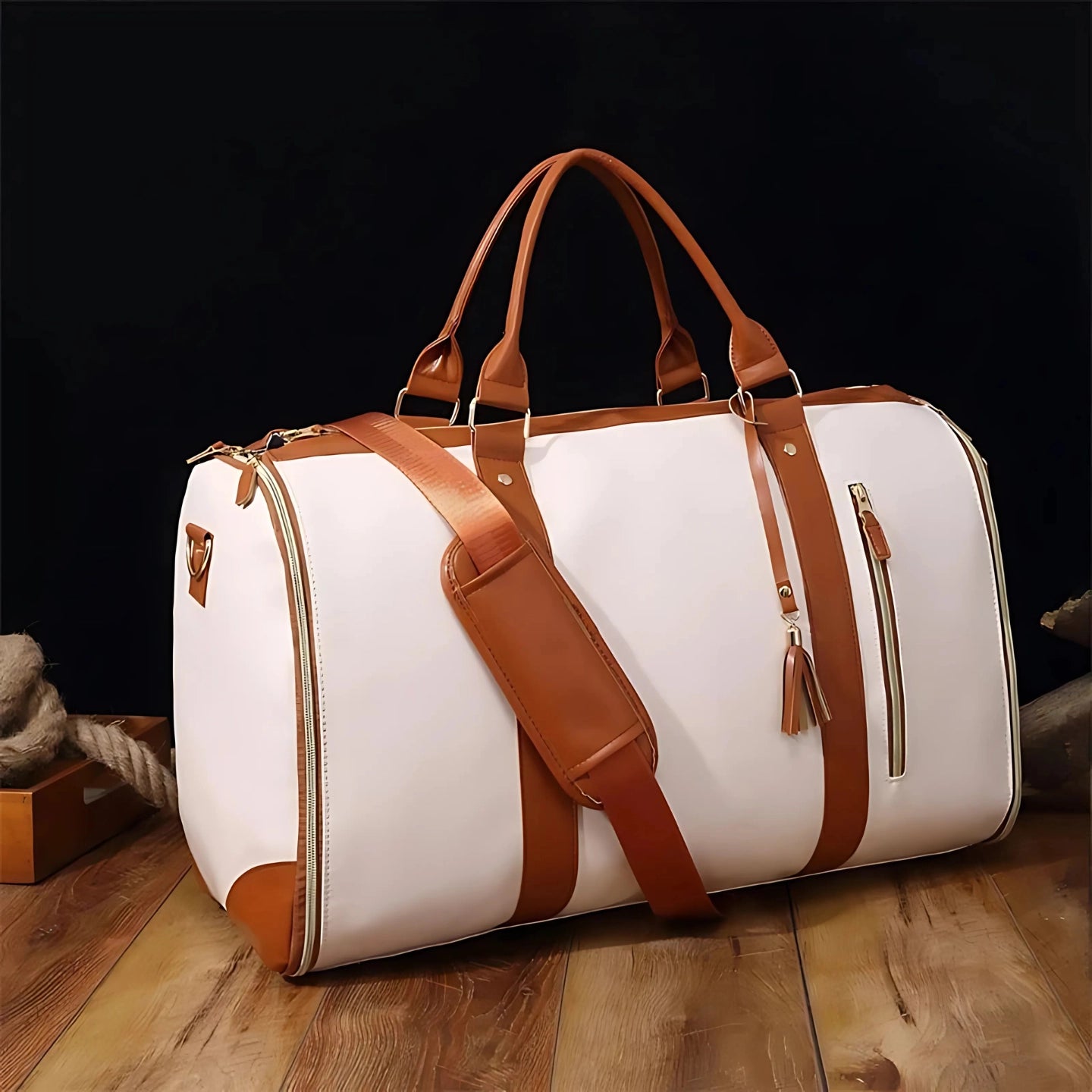 Chic-Fold 75L travel duffel bag in white with brown accents, featuring sturdy handles and a detachable shoulder strap.