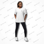 Female model in white Cool-Fit Quick-Dry Athletic Tee Shirt paired with leggings, highlighting its breathable and versatile design.