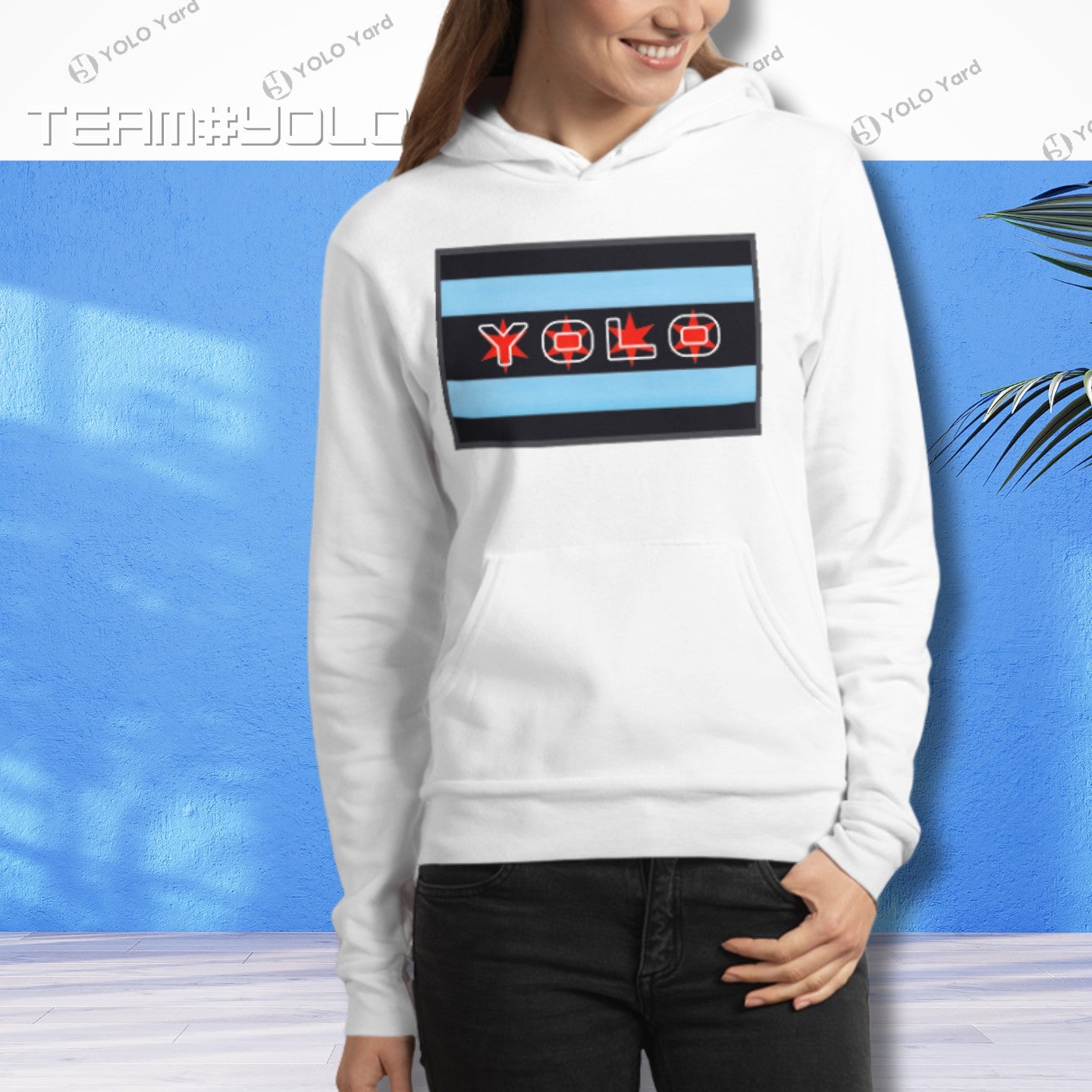 White pullover hoodie modeled by a woman, featuring the YOLO-Chicago Flag design with Chicago flag stripes and YOLO branding. Comfortable and chic.