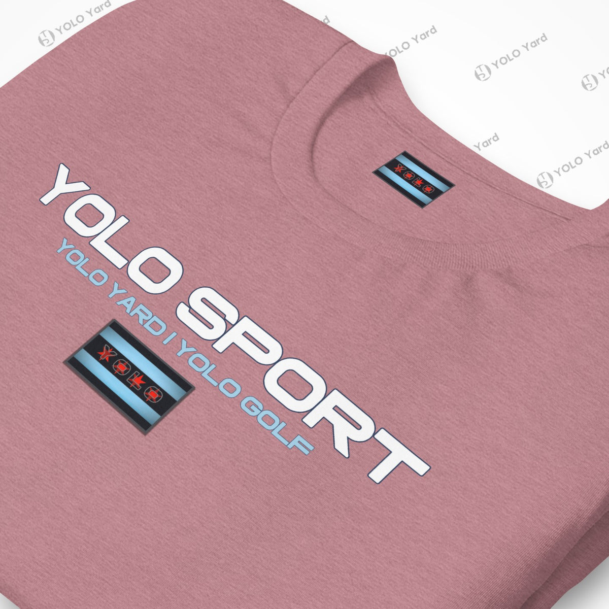 Close-up of a pink YOLO Sport t-shirt with a bold logo and Chicago flag-inspired design. Soft and breathable fabric.