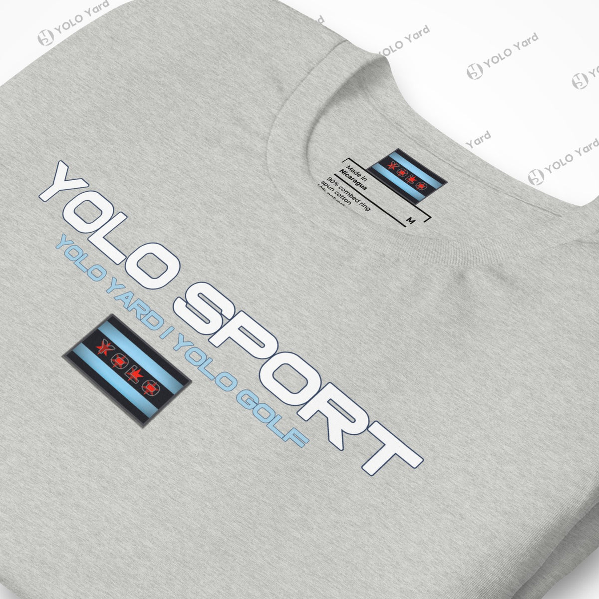 Close-up of a light gray YOLO Sport t-shirt with a sleek logo and Chicago flag-inspired design. Perfect for casual or active wear.