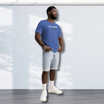 Blue YOLO Sport unisex t-shirt worn by a man paired with denim shorts. Lightweight and breathable for summer or activewear.