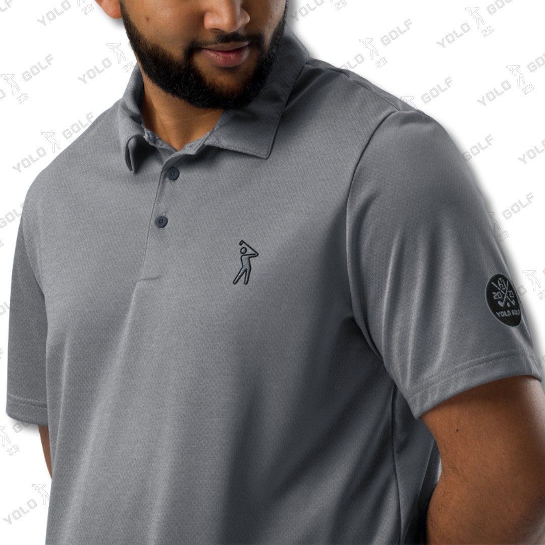 Close-up of a man wearing the space-dyed gray polo shirt from 