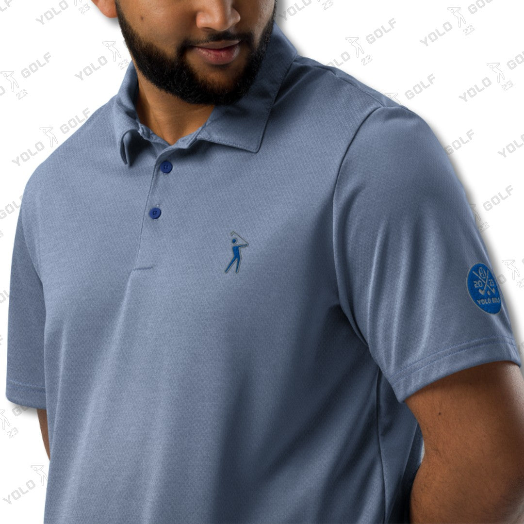 Close-up of the signature blue space-dyed polo shirt from 