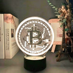 Bitcoin-themed 3D LED desk lamp in white light, displayed on a desk with books and decor, ideal for home office use.