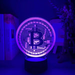 Purple-lit Bitcoin 3D LED desk lamp, adding a vibrant and modern touch to home or office decor.