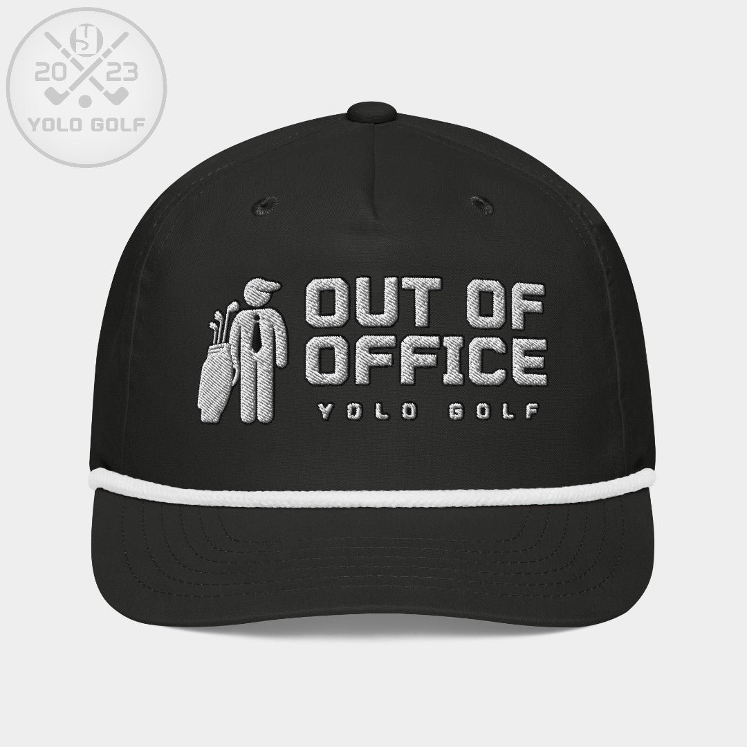 Black 'Out of Office' golf rope cap with silver and white embroidery, featuring a golf bag logo and #YOLO Golf branding on the front.