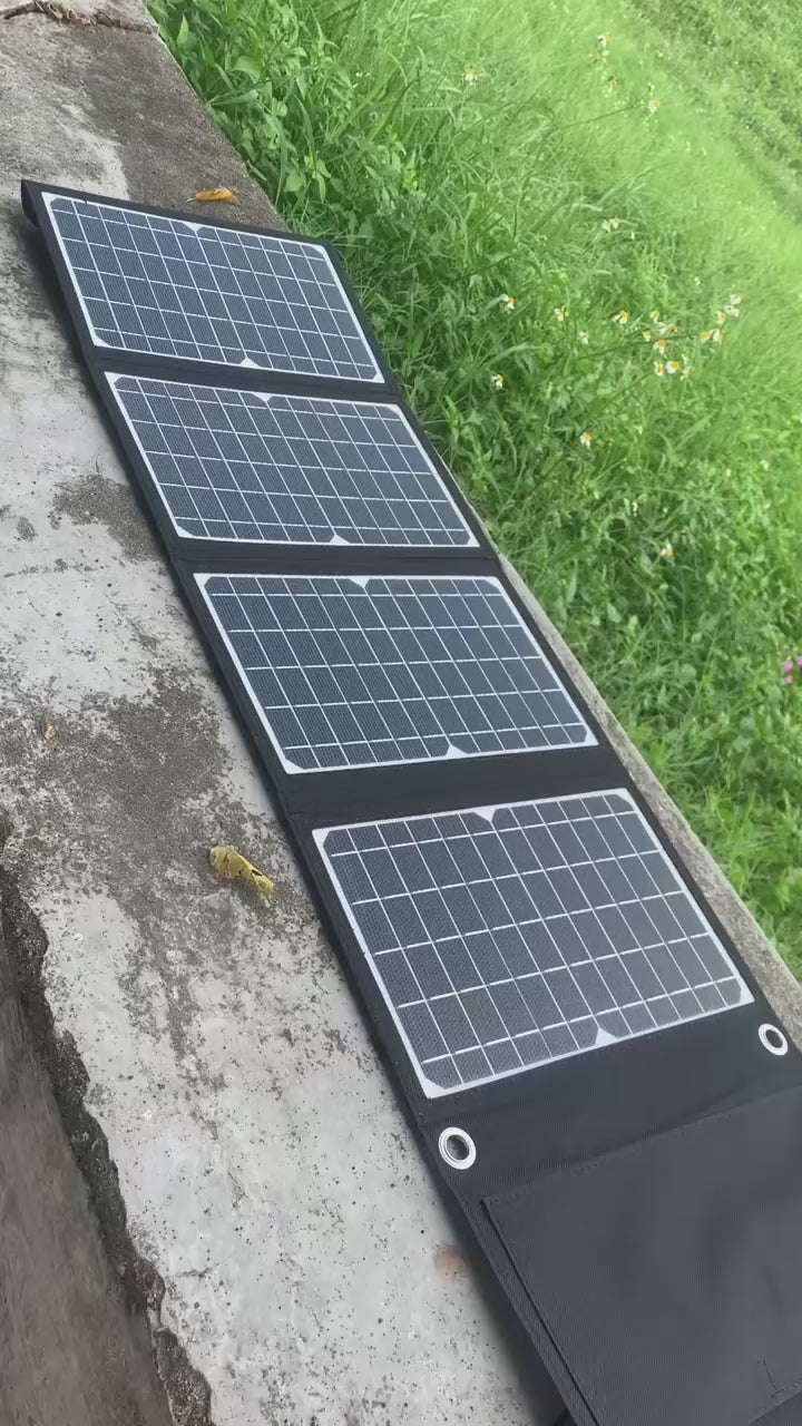 EcoLite Charge foldable solar panels laid out outdoors, highlighting portability and efficient energy capture.