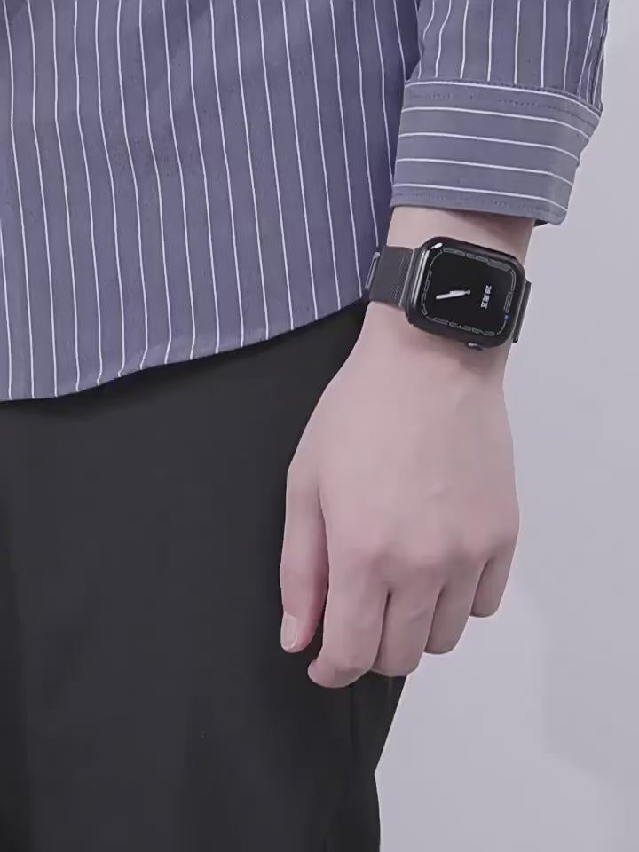 Person wearing a black Milanese steel loop strap on an Apple Watch, highlighting its stylish and comfortable fit.