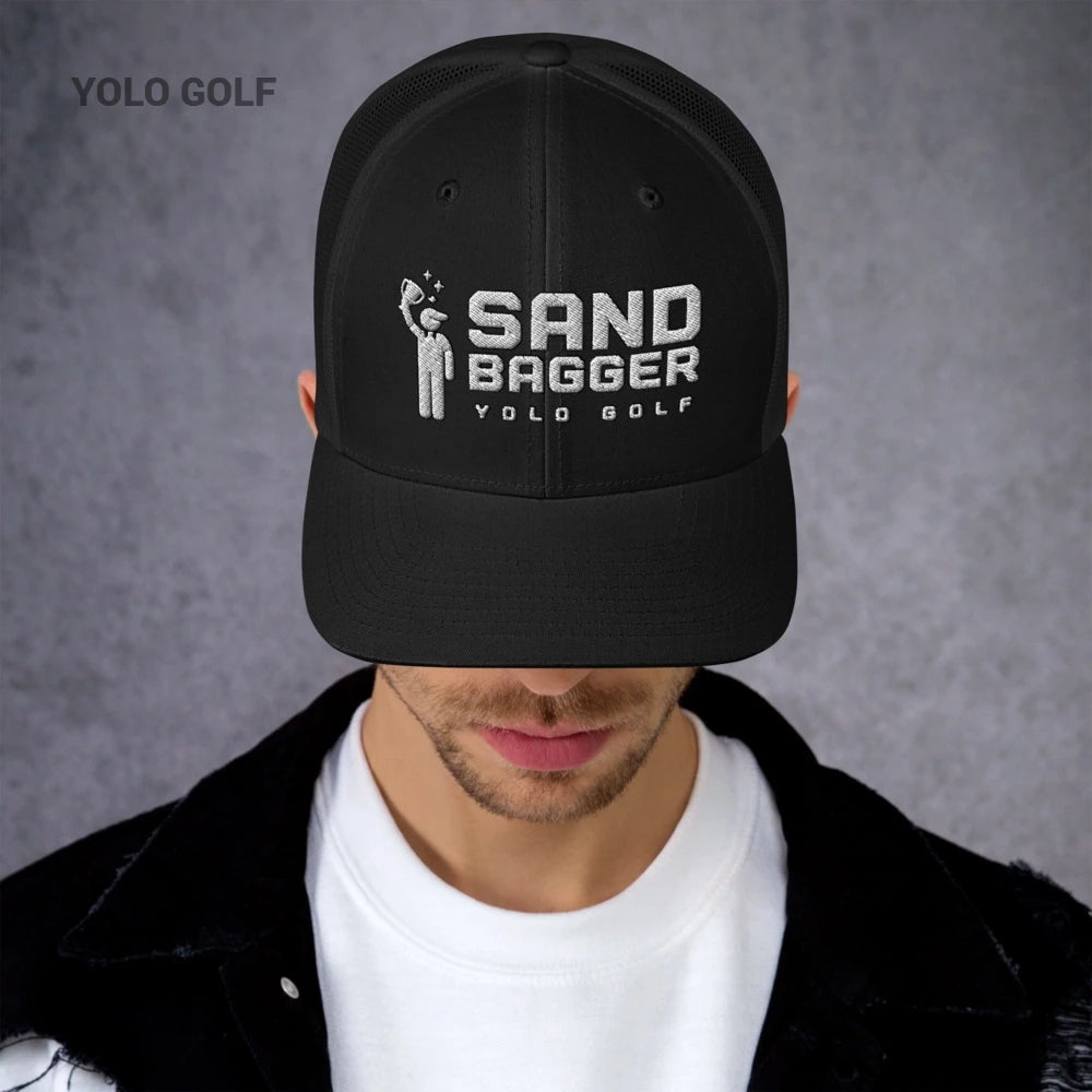 Black Sandbagger trucker hat worn by a man, showcasing its 