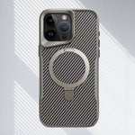 Grey SecureGrip Carbon 360 iPhone case with carbon fiber texture and MagSafe ring on a striped background.