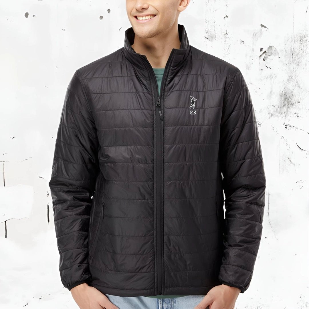 Black SwingWarm 23 Puffer Jacket from #YOLO Golf Sportswear modeled by a man, featuring lightweight quilted design and zippered front for winter wear.