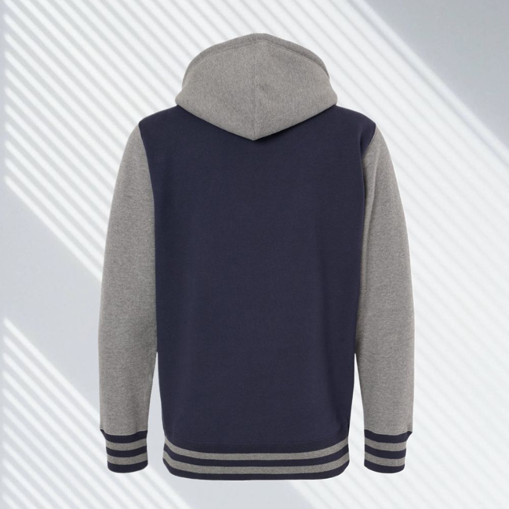 Back view of navy and gray varsity zip hoodie with hood and striped cuffs from 